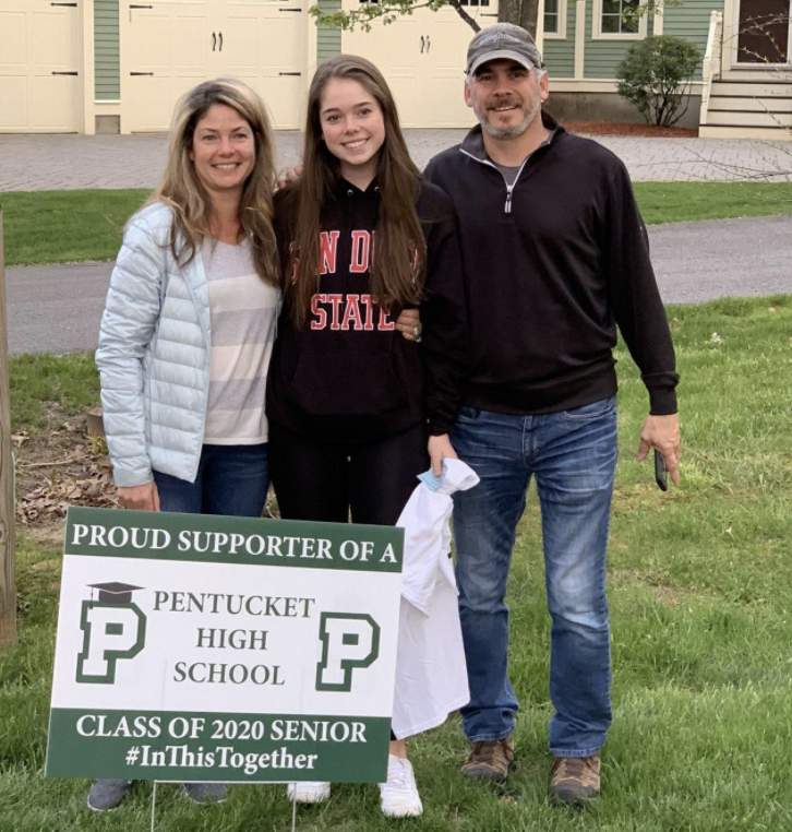 Pentucket community members deliver signs to graduates